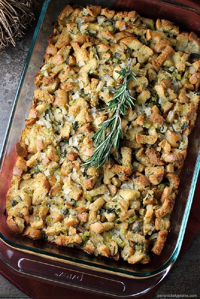 stuffing in a dish with fresh rosemary on top