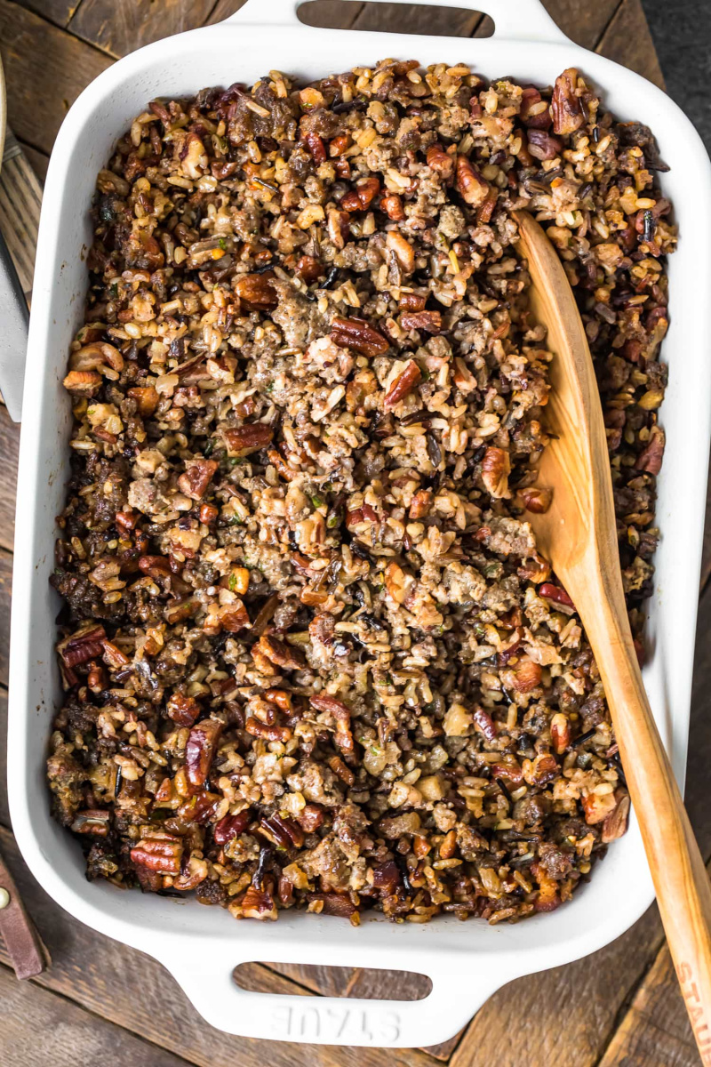 dish of stuffing with wooden spoon