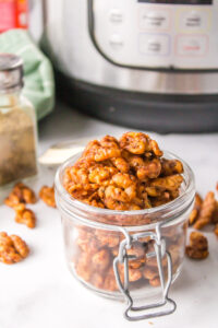 open jar of cajun spiced walnuts