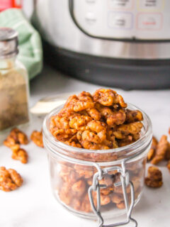 open jar of cajun spiced walnuts