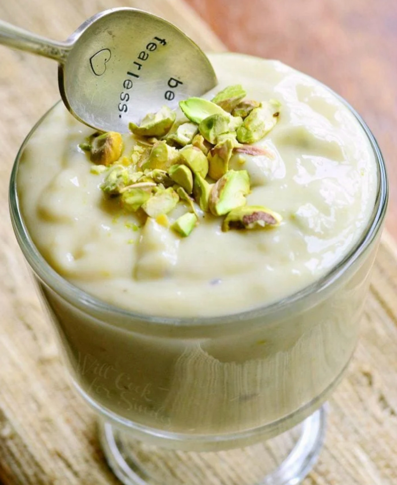 pistachio pudding in glass dish with spoon
