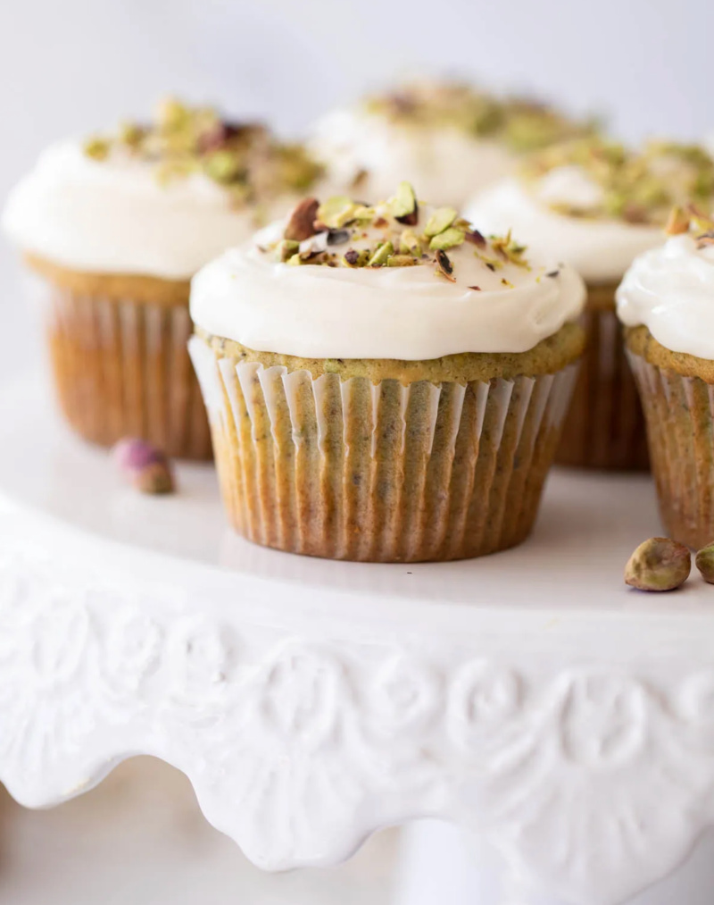 honey pistachio cupcakes on display platter