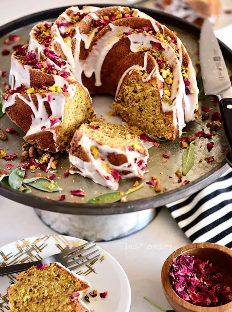 pistachio bundt cake sliced open on display platter