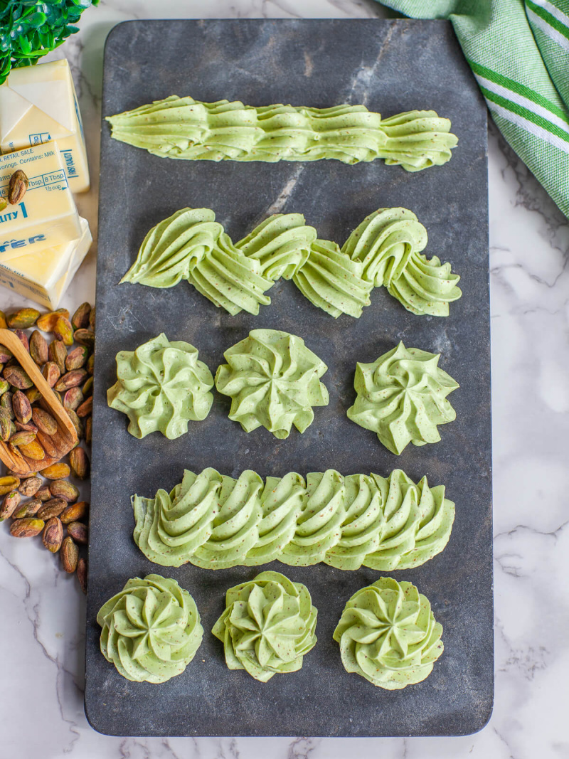 pistachio buttercream designs on a board