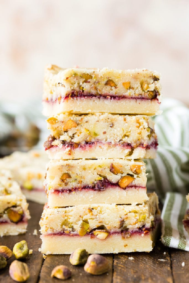 raspberry pistachio shortbread bars stacked