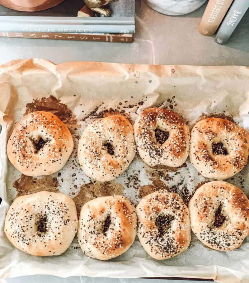 several sourdough bagels on a tray