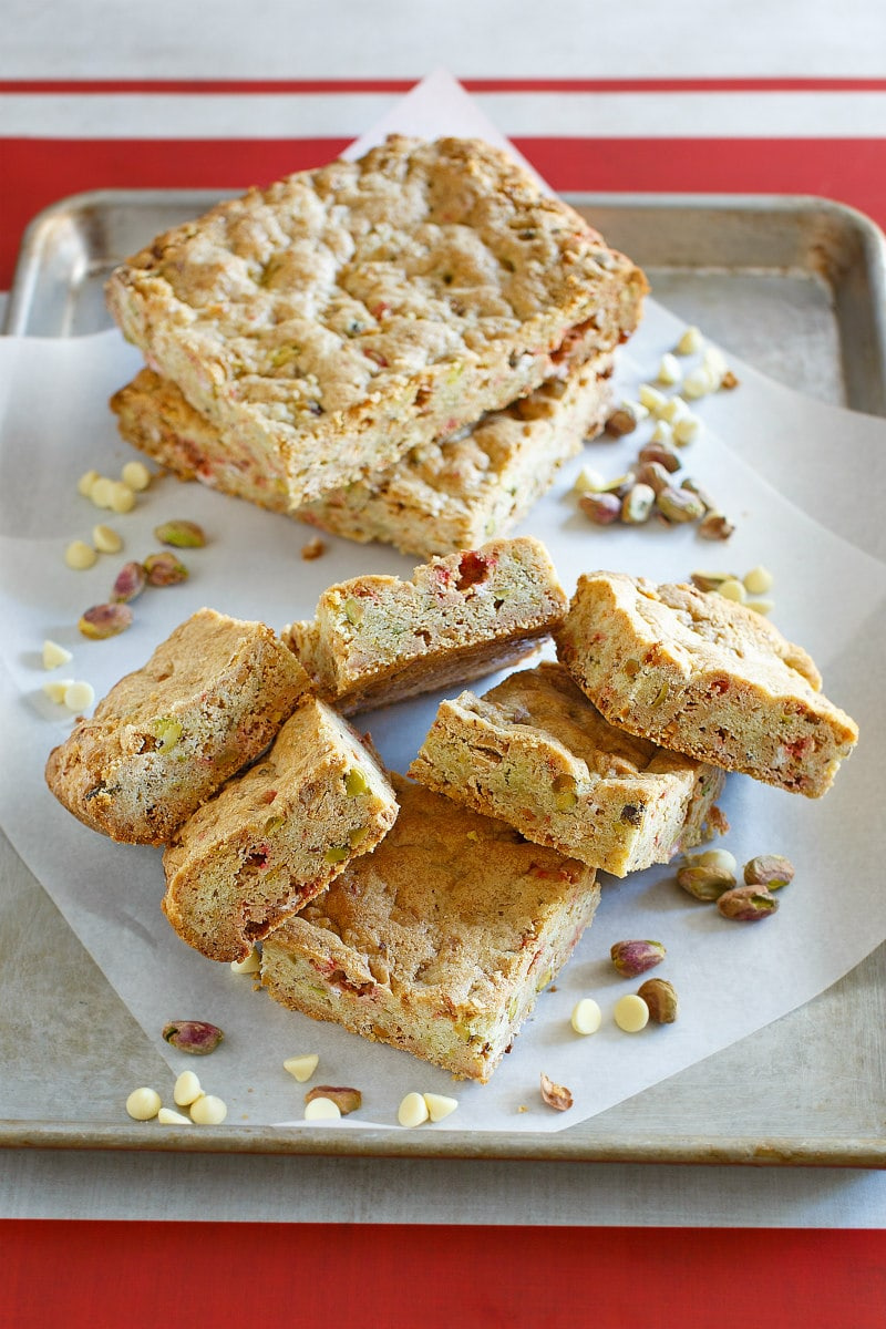 white chocolate peppermint pistachio bars on white platter