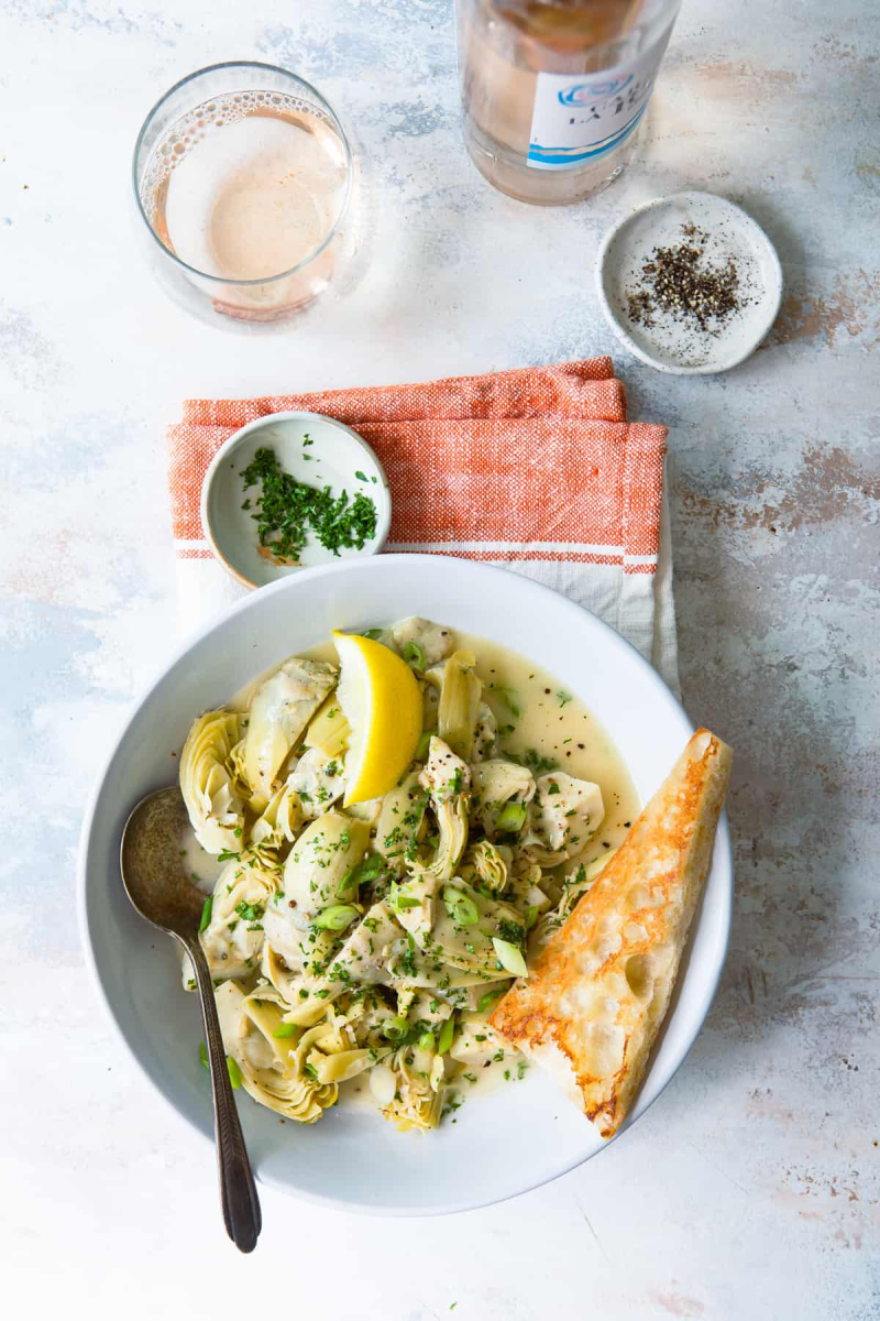 artichoke hearts in white wine and lemon on plate