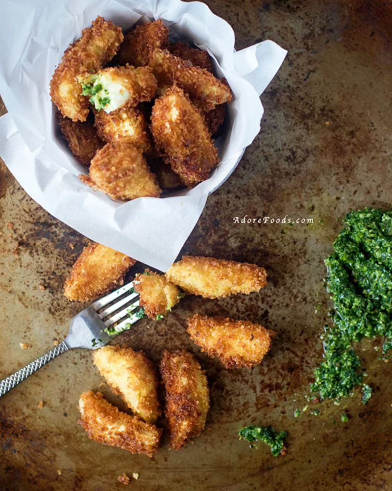 crispy fried artichoke hearts in dish with salsa verde