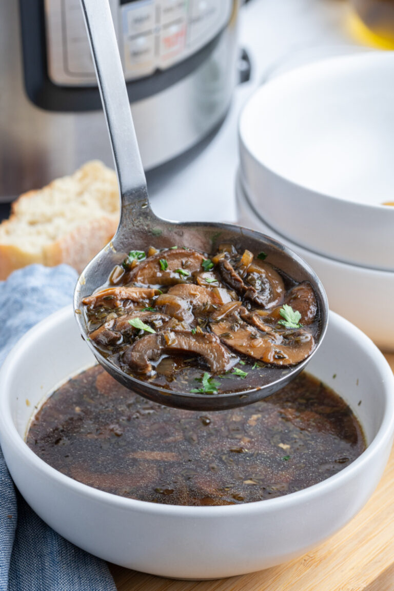 ladle full of instant pot wild mushroom soup