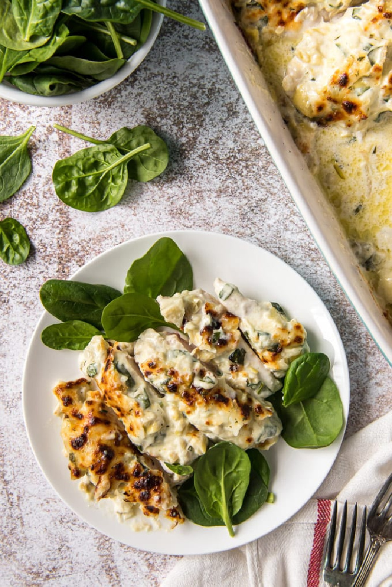 spinach artichoke chicken on plate