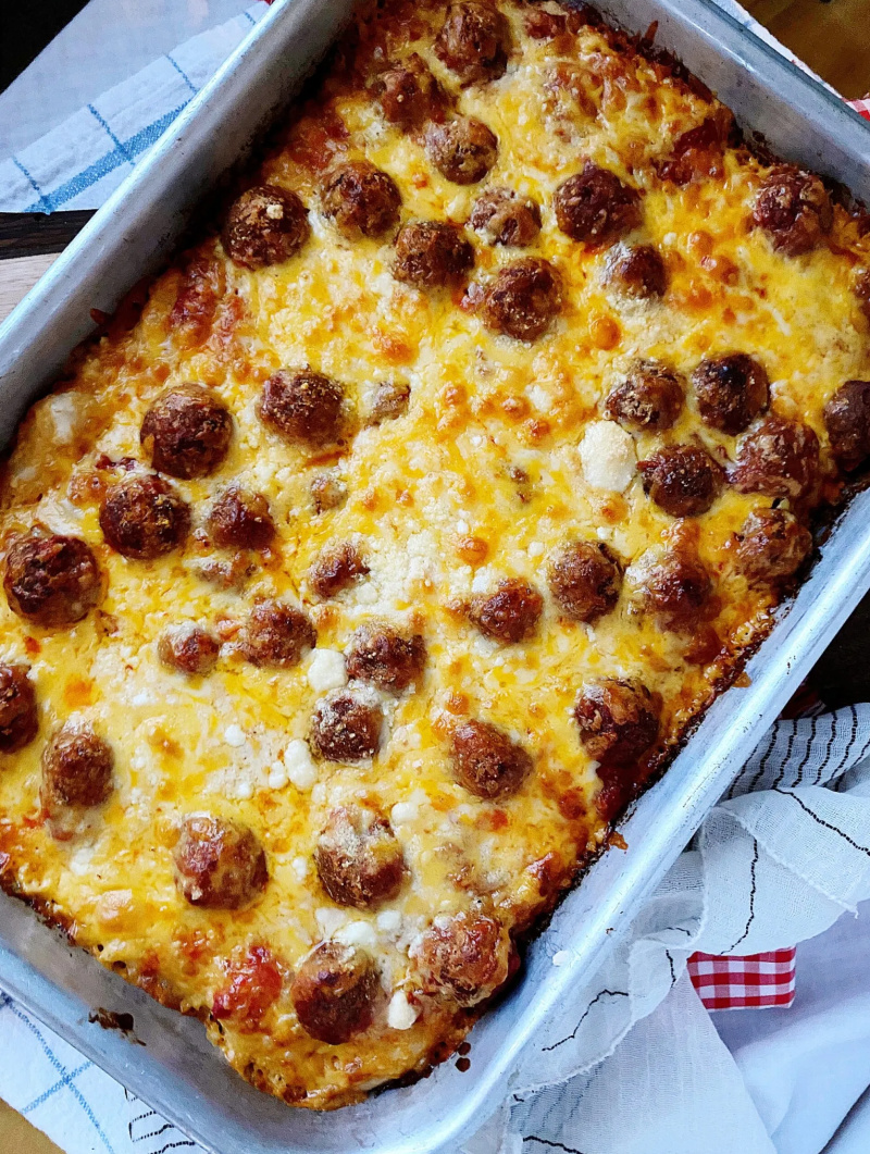 cheesy meatball deep dish pizza in pan