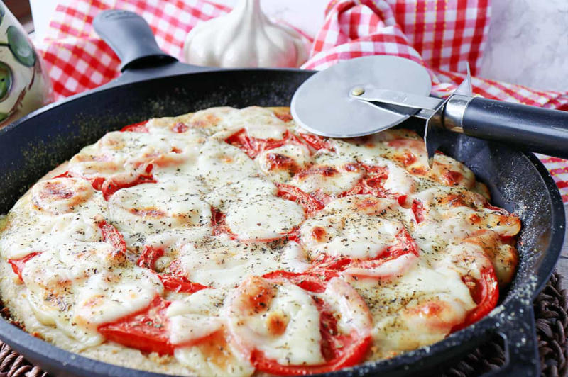 Garlic Lover's Pizza in Skillet with cutter