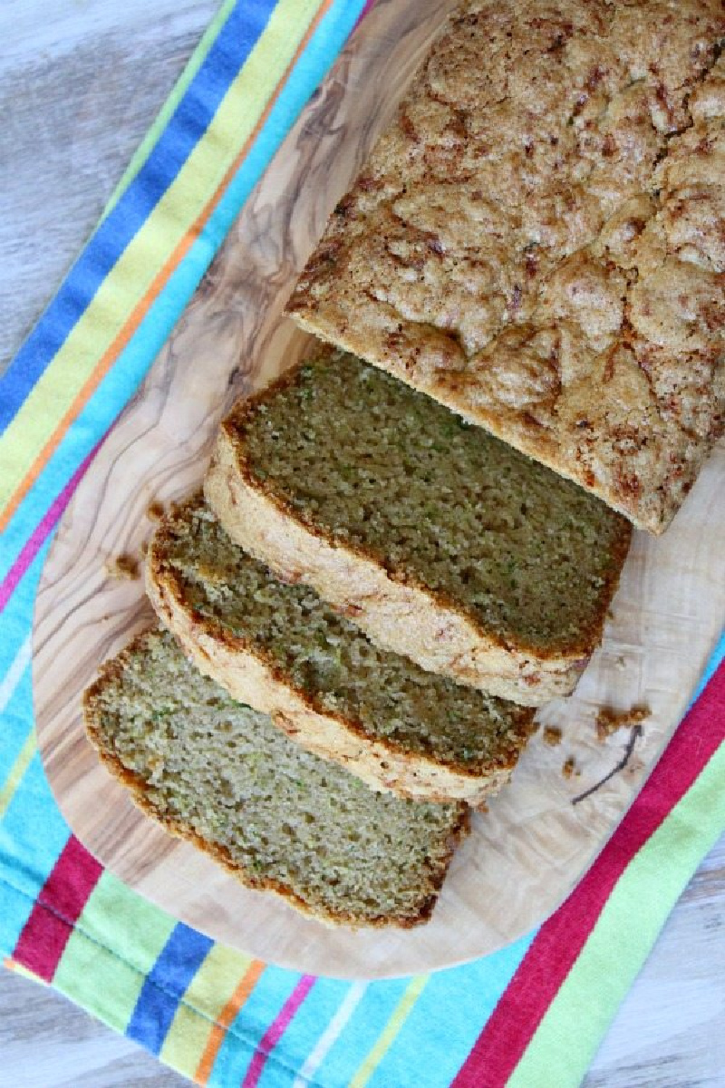 loaf of classic zucchini bread with a few slices