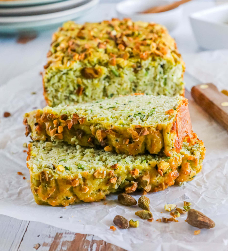 loaf of low carb zucchini pistachio bread sliced