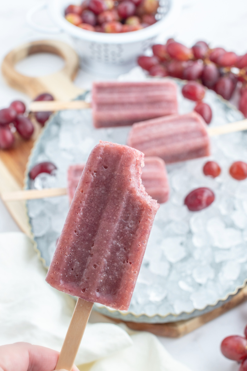 grape popsicle with bite taken out of it