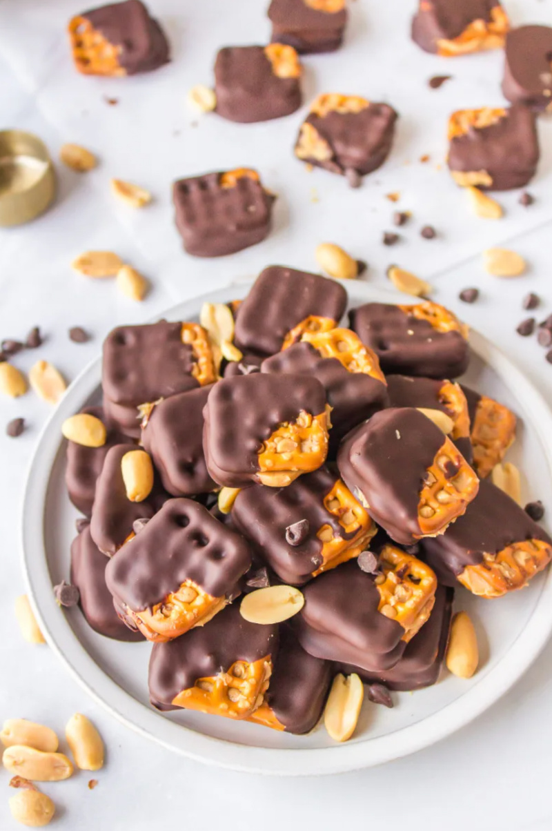 chocolate dipped peanut butter pretzels on plate