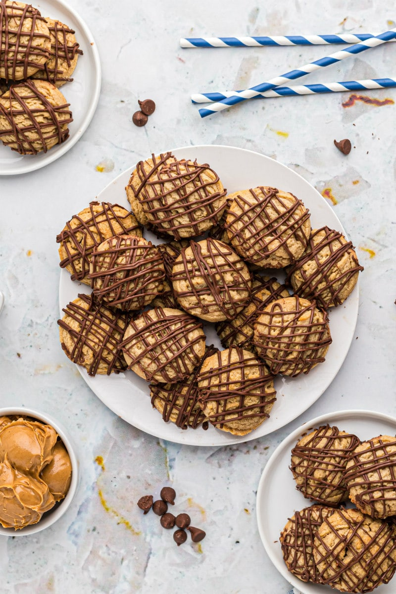 plate of chocolate drizzled peanut butter cookies