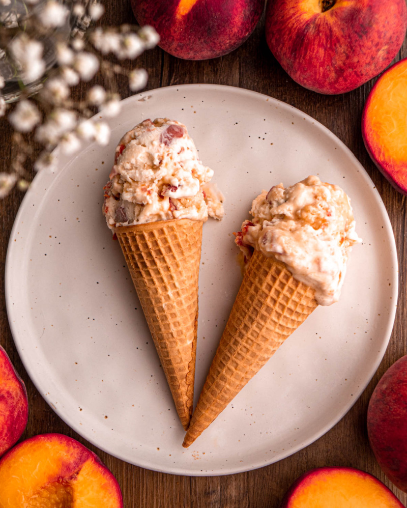 two peach cobbler ice cream cones