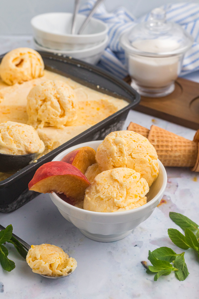 peach ice cream in pan and then serving in bowl