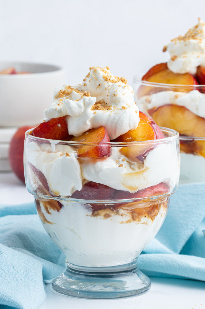 peaches and cream parfait in a glass