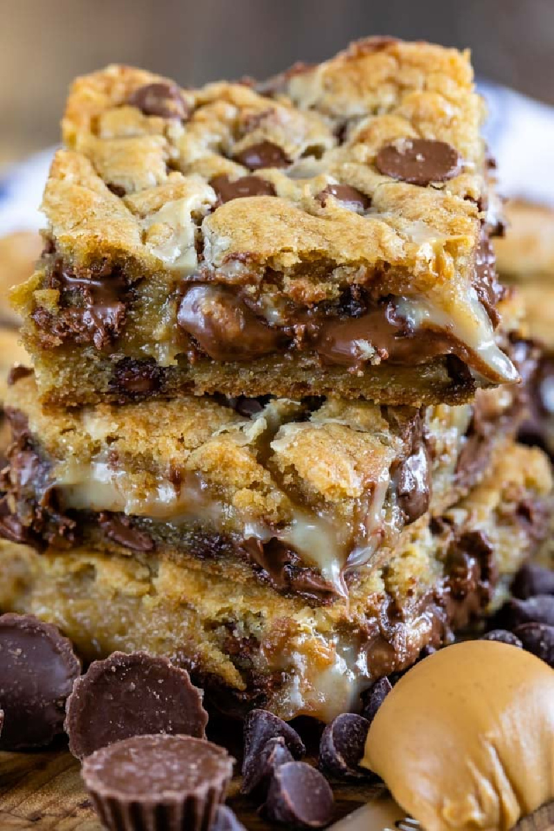 three peanut butter cup gooey bars stacked
