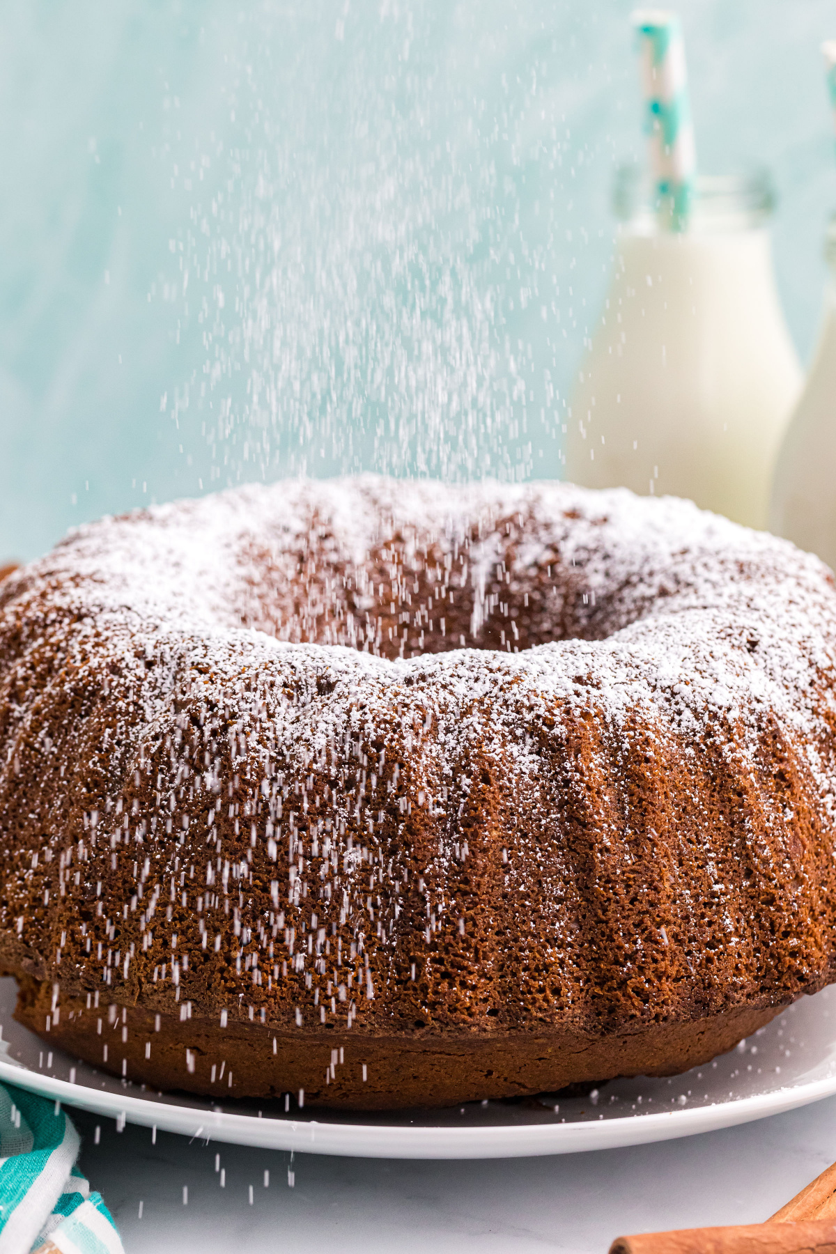 side view of pumpkin pound cake with powdered sugar sprinkling on top
