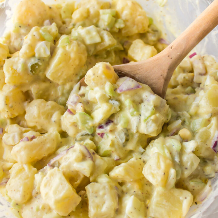 sweet pickle potato salad in a bowl with a spoon