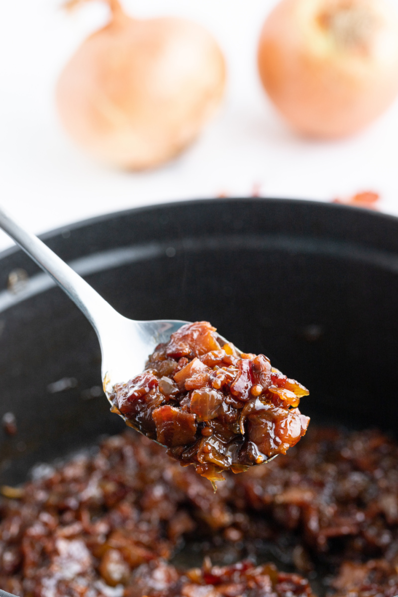 spooning bacon jam out of pot