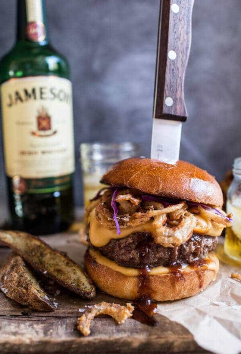 jameson whiskey blue cheese burger with knife stuck into it