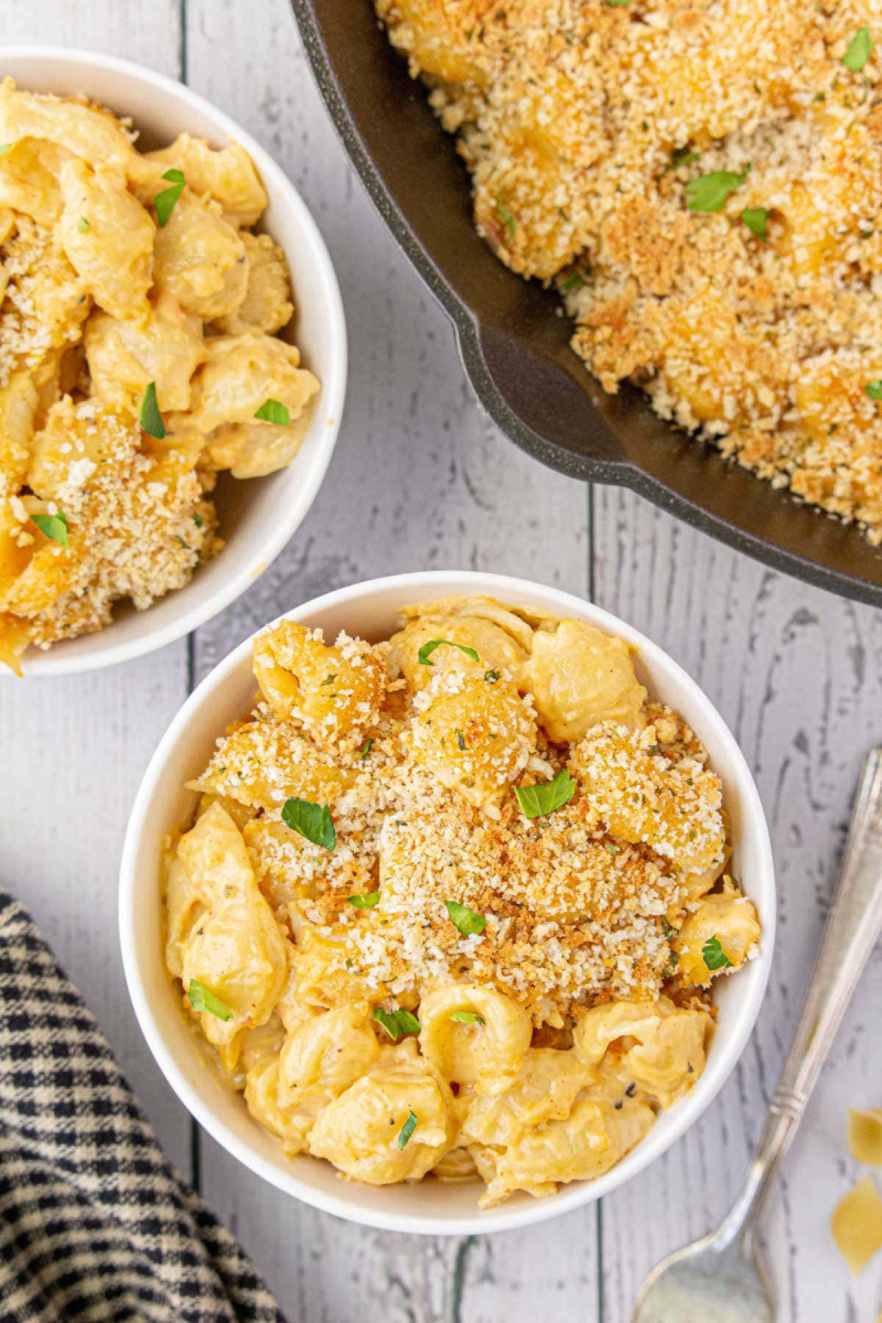 two dishes of southern baked beer macaroni and cheese with pot