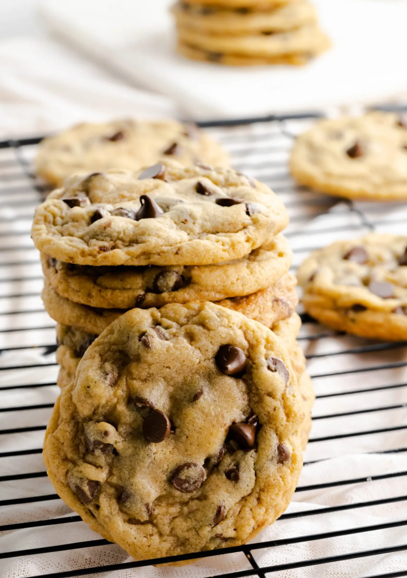 mrs. field's copycat chocolate chip cookies on a baking rack