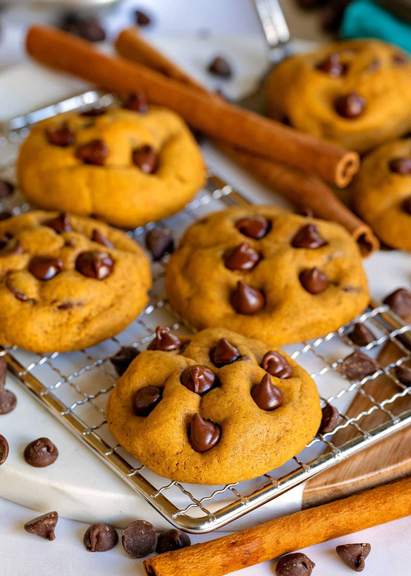 pumpkin chocolate chip cookies on a baking rack