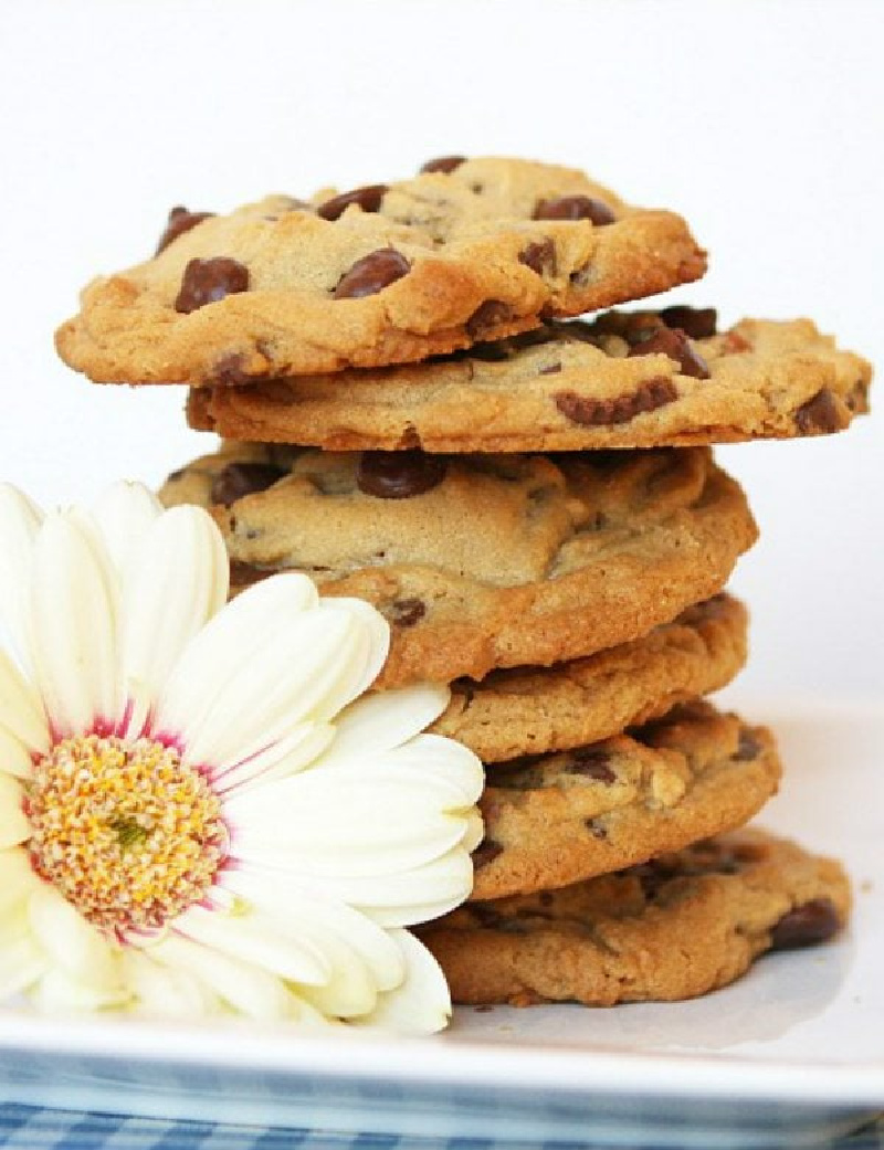 stack of reeses stuffed peanut butter chocolate chip cookies with a flower