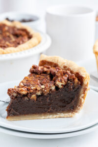 slice of bourbon chocolate pecan pie on a plate