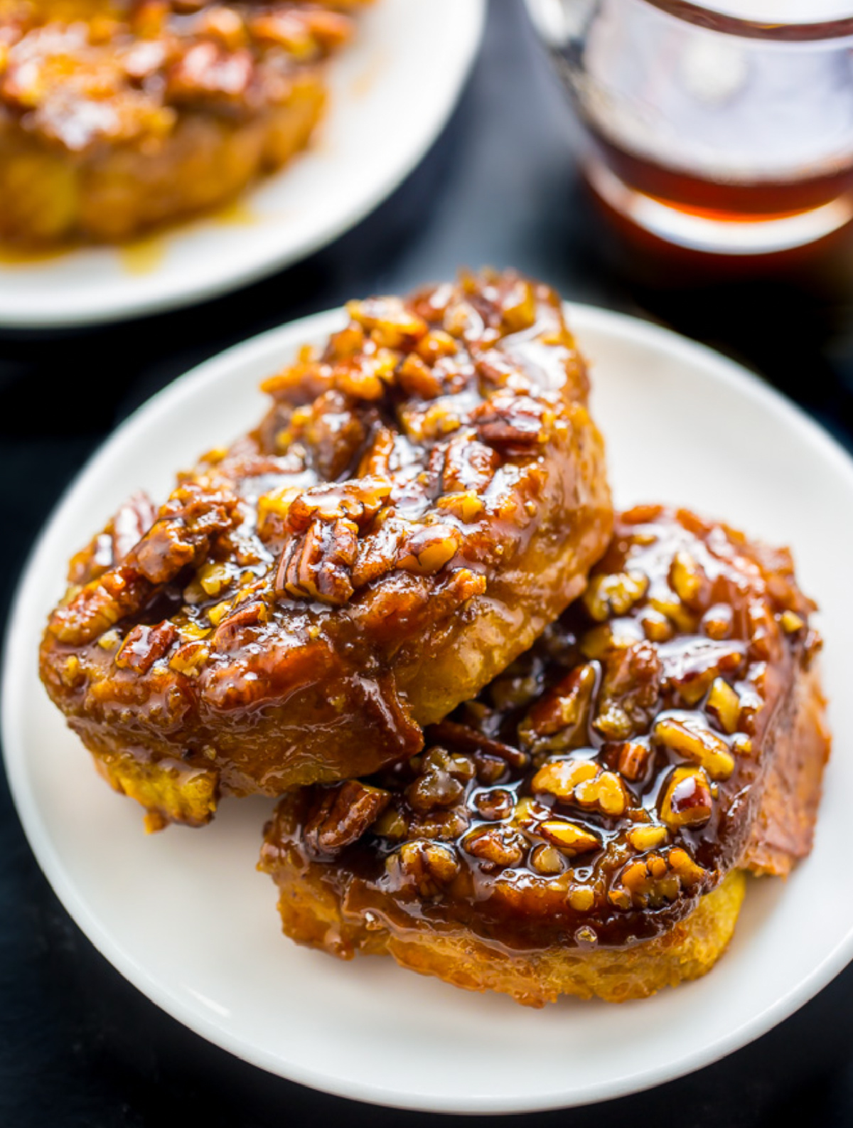 two slices of overnight pecan pie french toast on plate