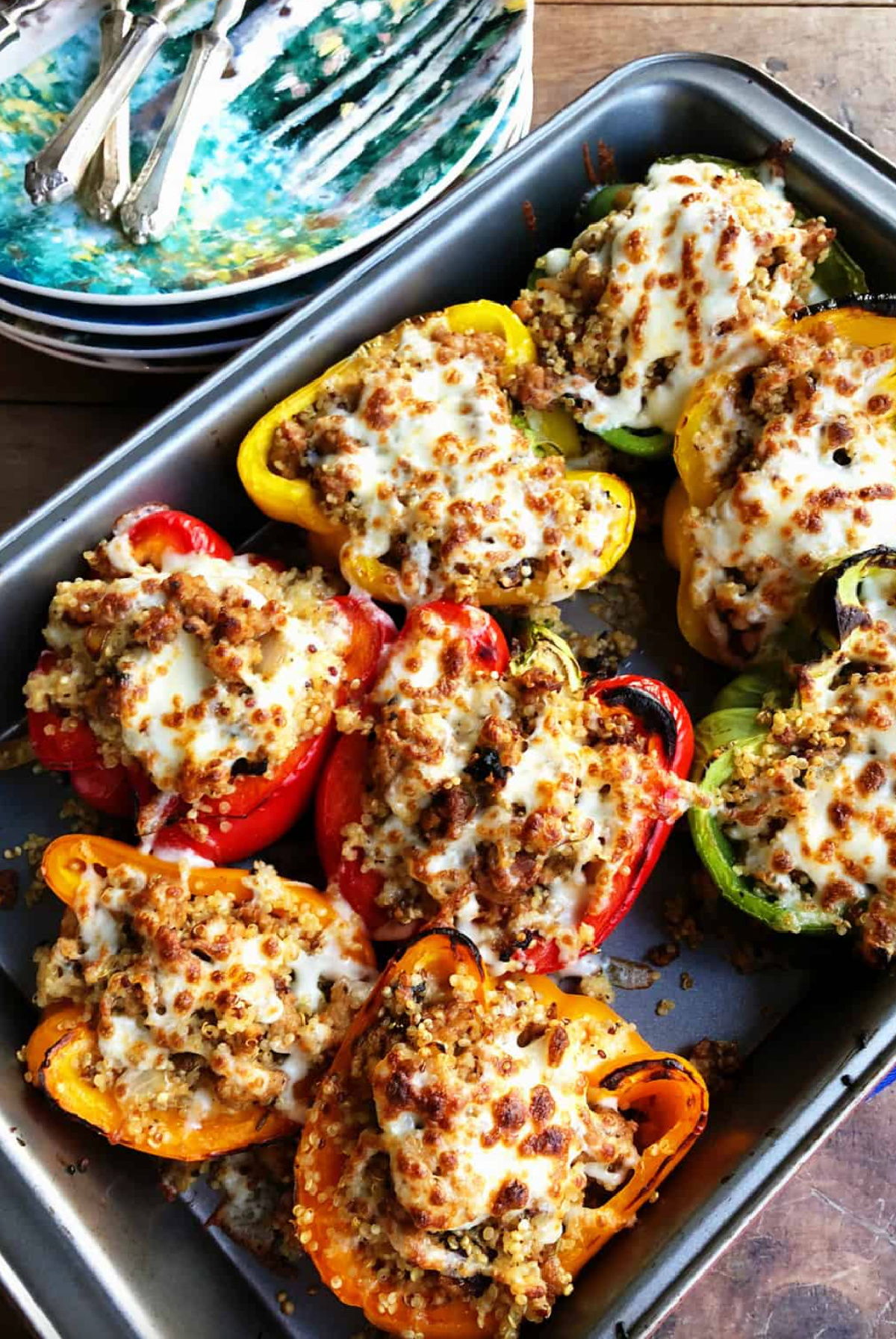 stuffed chicken sausage quinoa peppers in baking dish