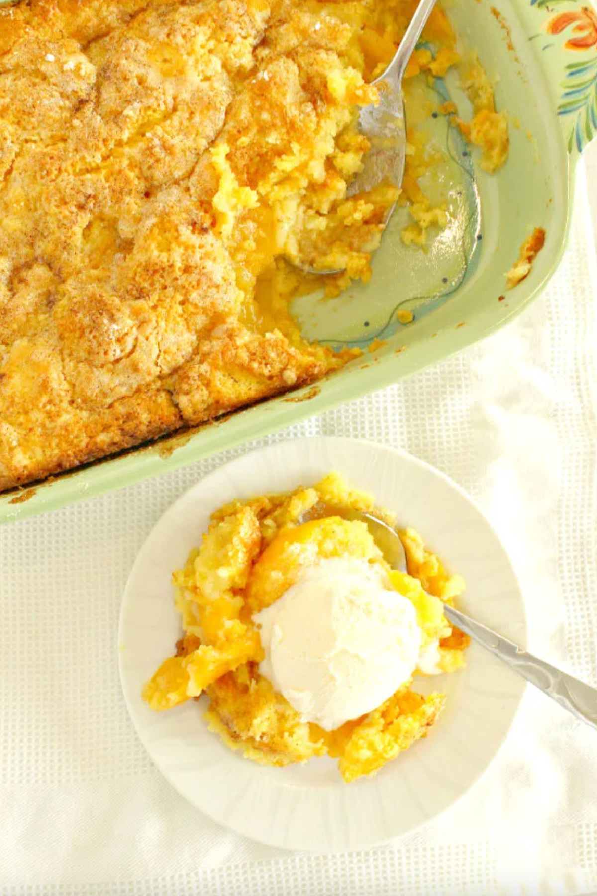 3 ingredient peach cobbler in baking dish with serving on plate with ice cream