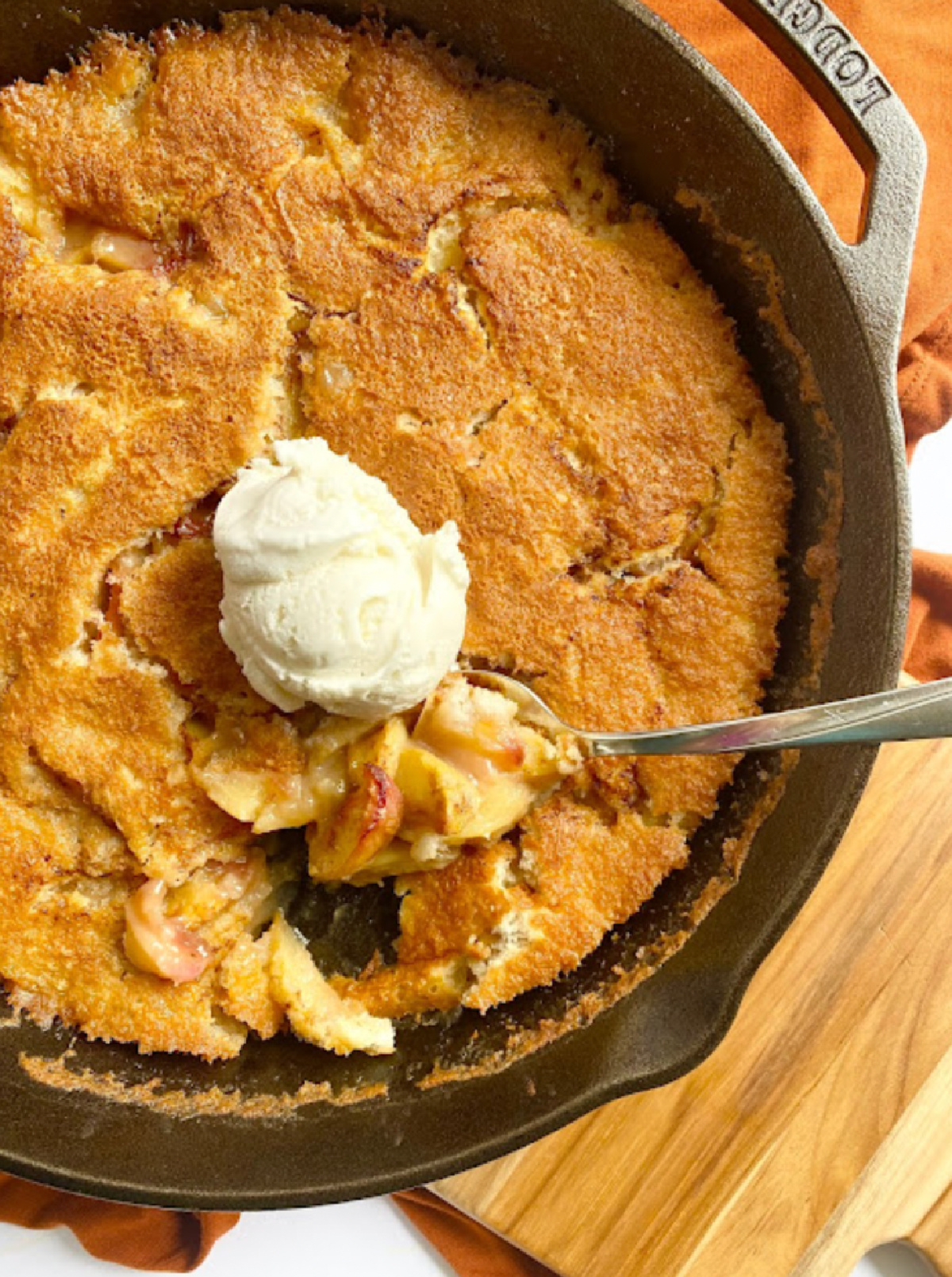 cast iron skillet with peach cobbler