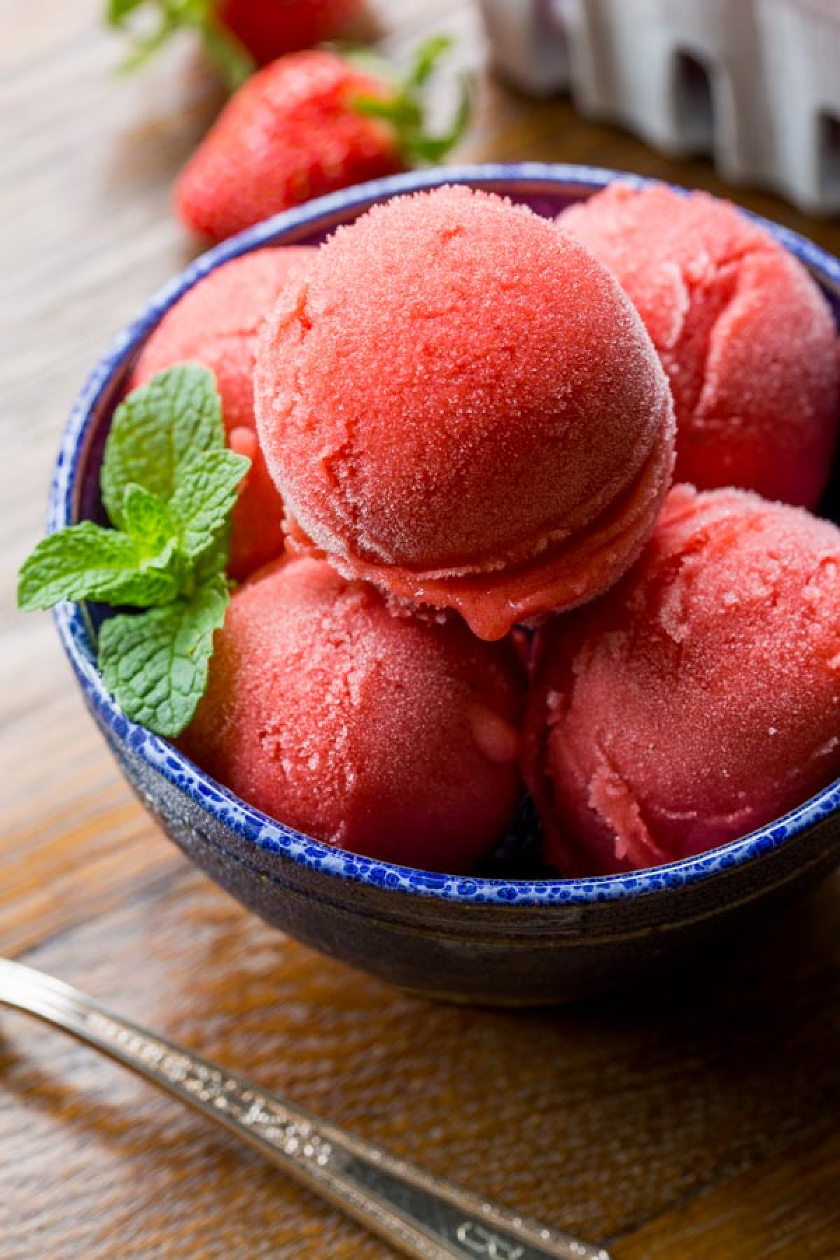 scoops of strawberry sorbet in dish