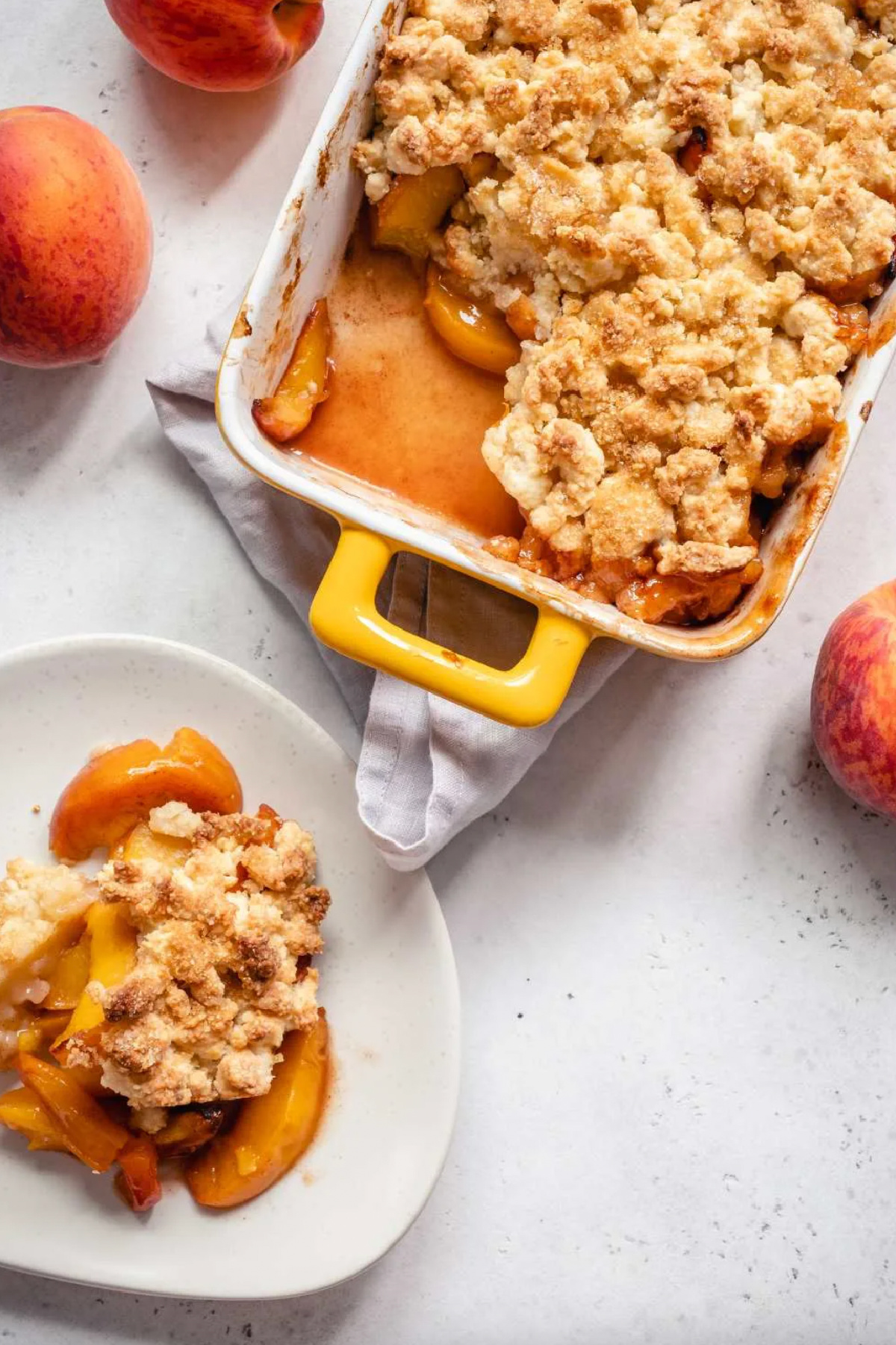 ina garten's peach cobbler in baking dish and serving on plate