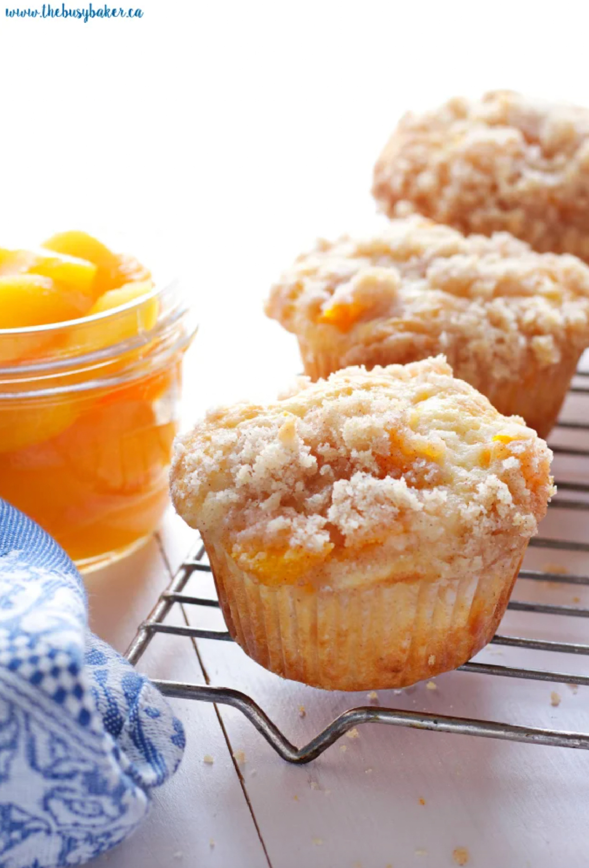 peach cobbler muffins on cooling rack