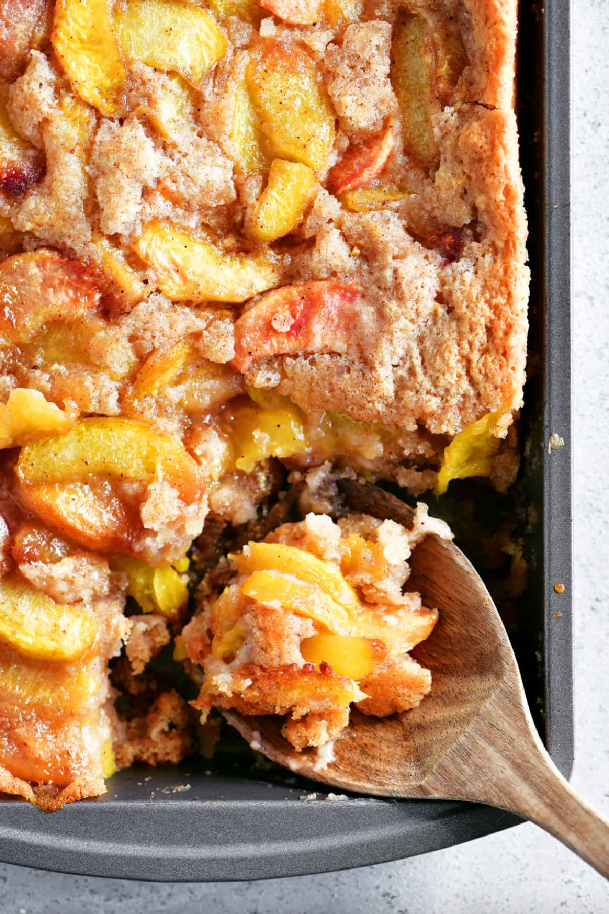 peach cobbler with bisquick in a baking dish