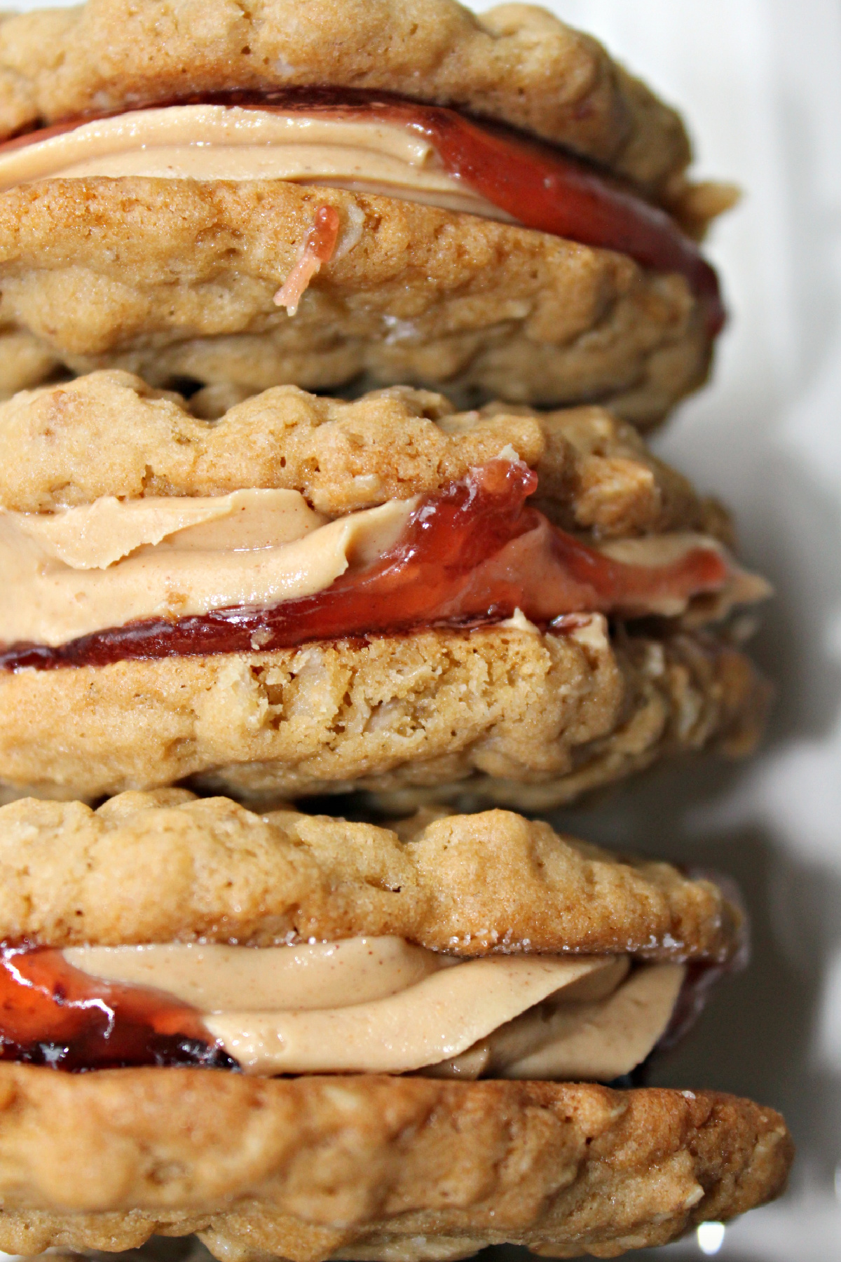 stack of peanut butter and jelly oatmeal cookie sandwiches