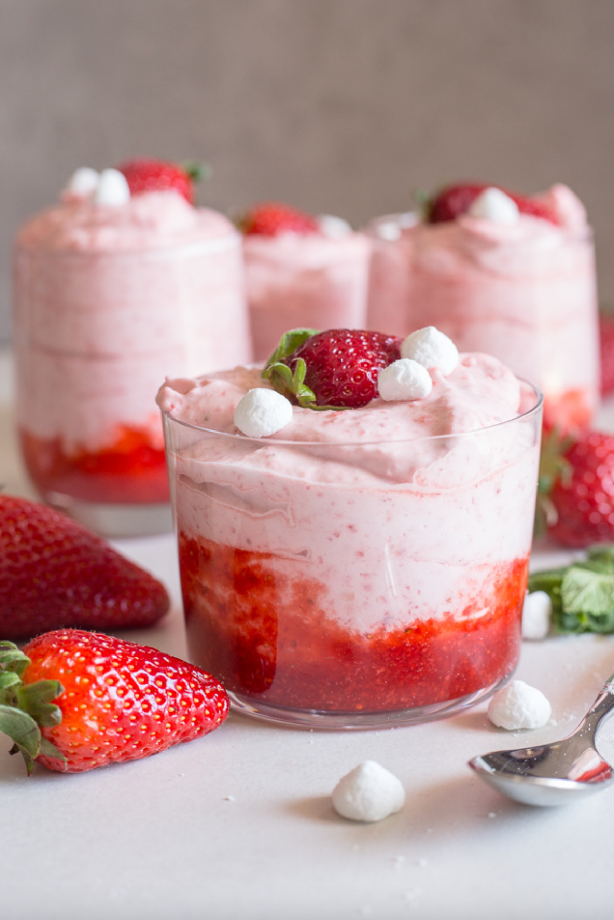several strawberry mousse cups
