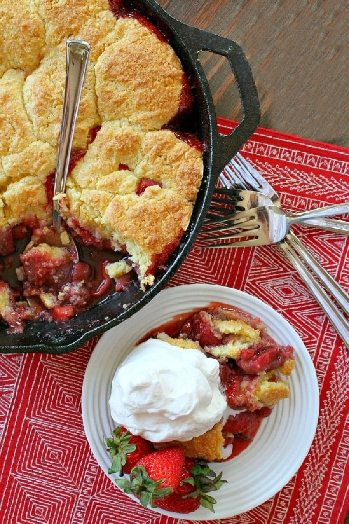 strawberry shortcake skillet cobbler with serving on plate too