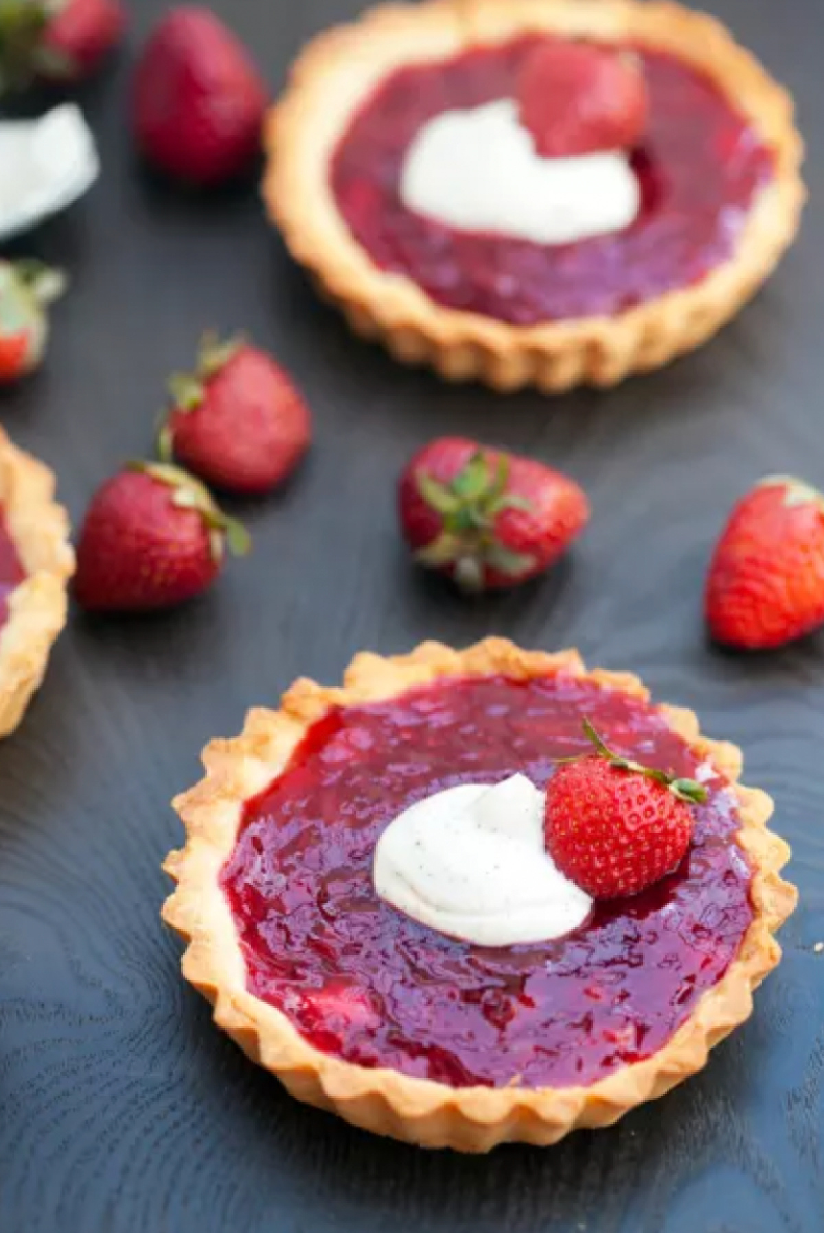 two strawberry tartlets