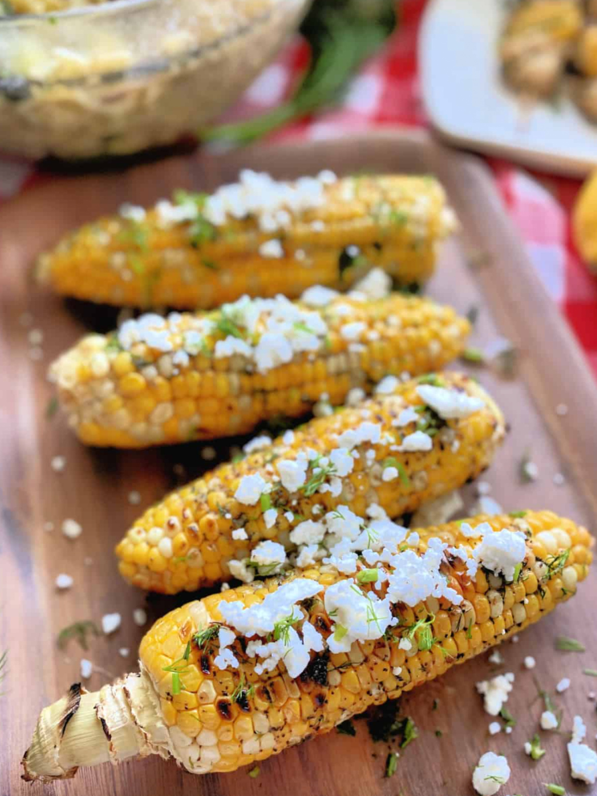 greek grilled corn on the cob on board