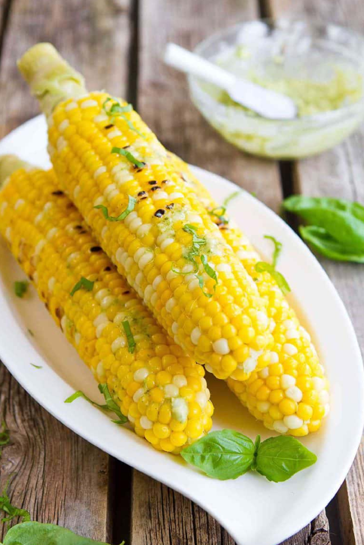 platter of pesto butter corn on the cob