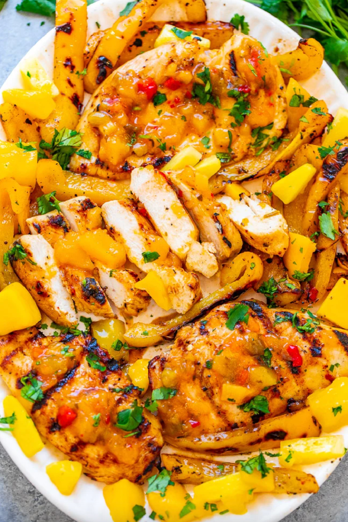 grilled mango pineapple chicken on platter